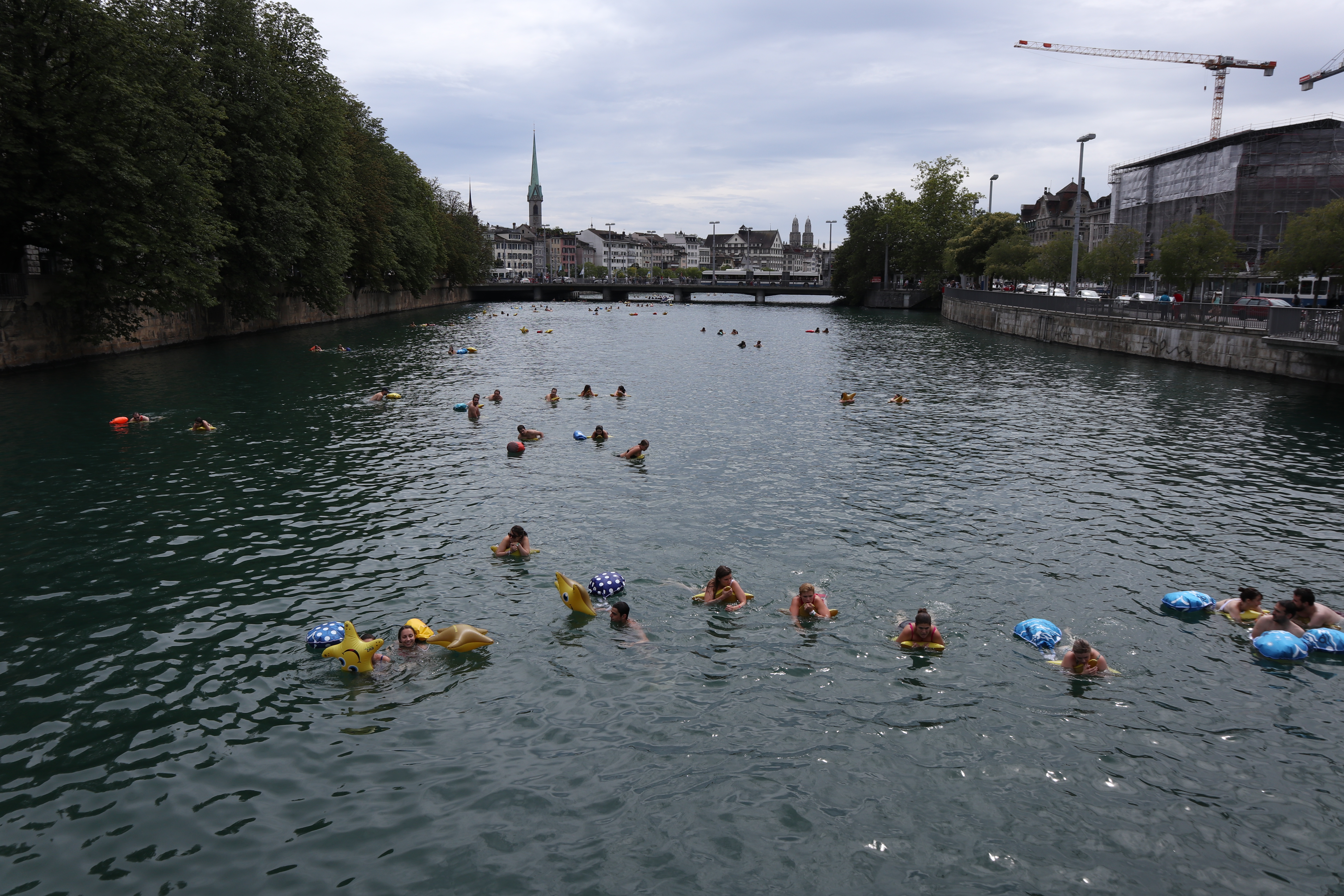 People swimming along the river Limmat
