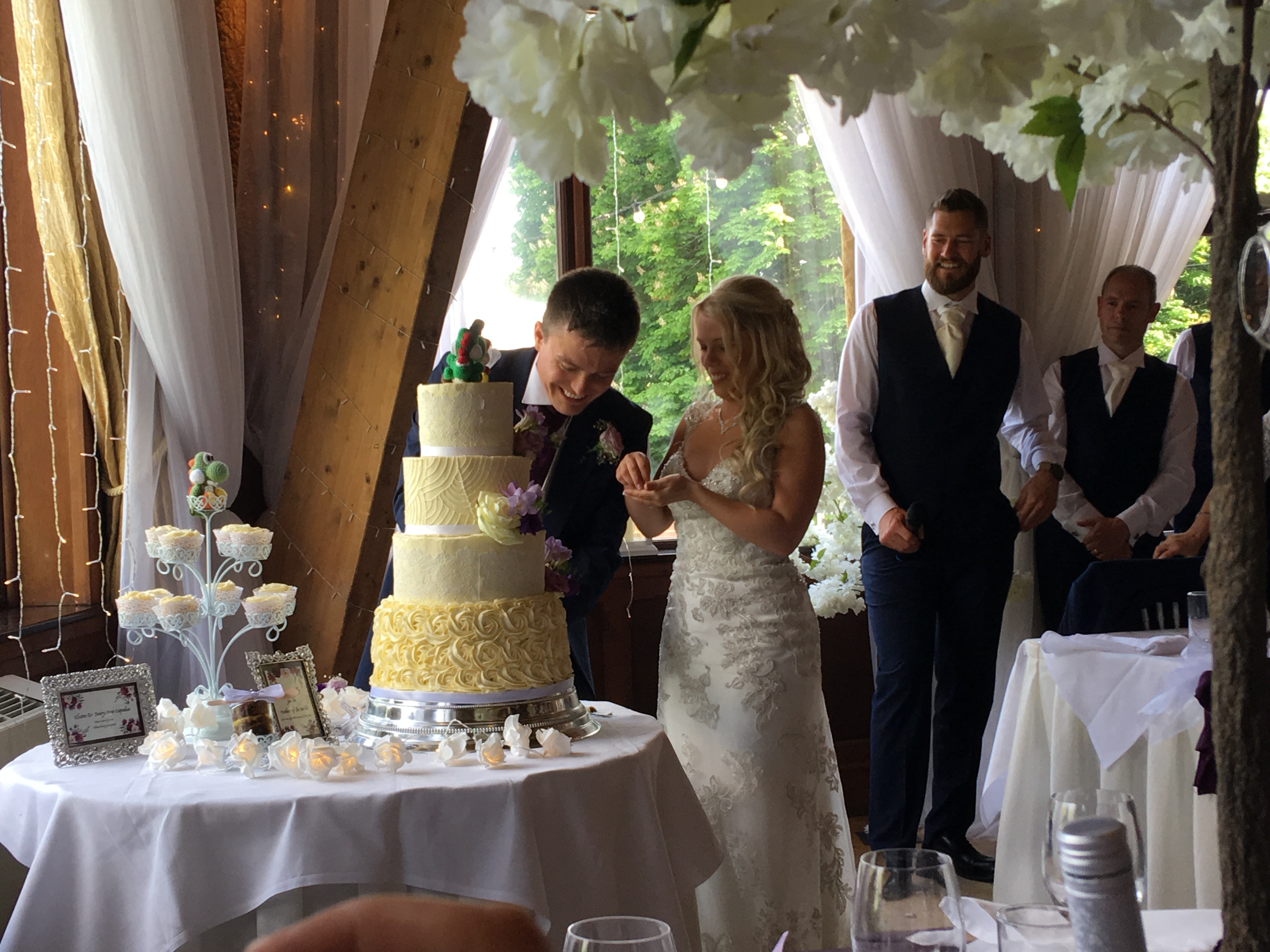 Neville and Bex cutting their wedding cake